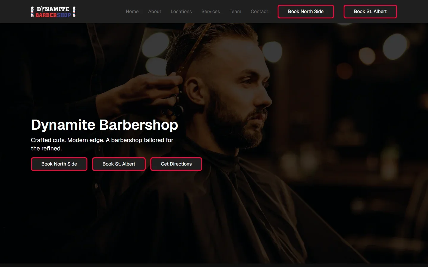 Dynamite Barbershop homepage on laptop